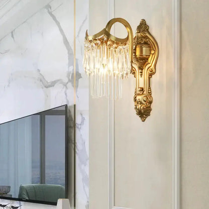 Contemporary gold wall lamp with clear crystal prisms and ornate backplate by Decorbites on Tampa Home & Garden Store