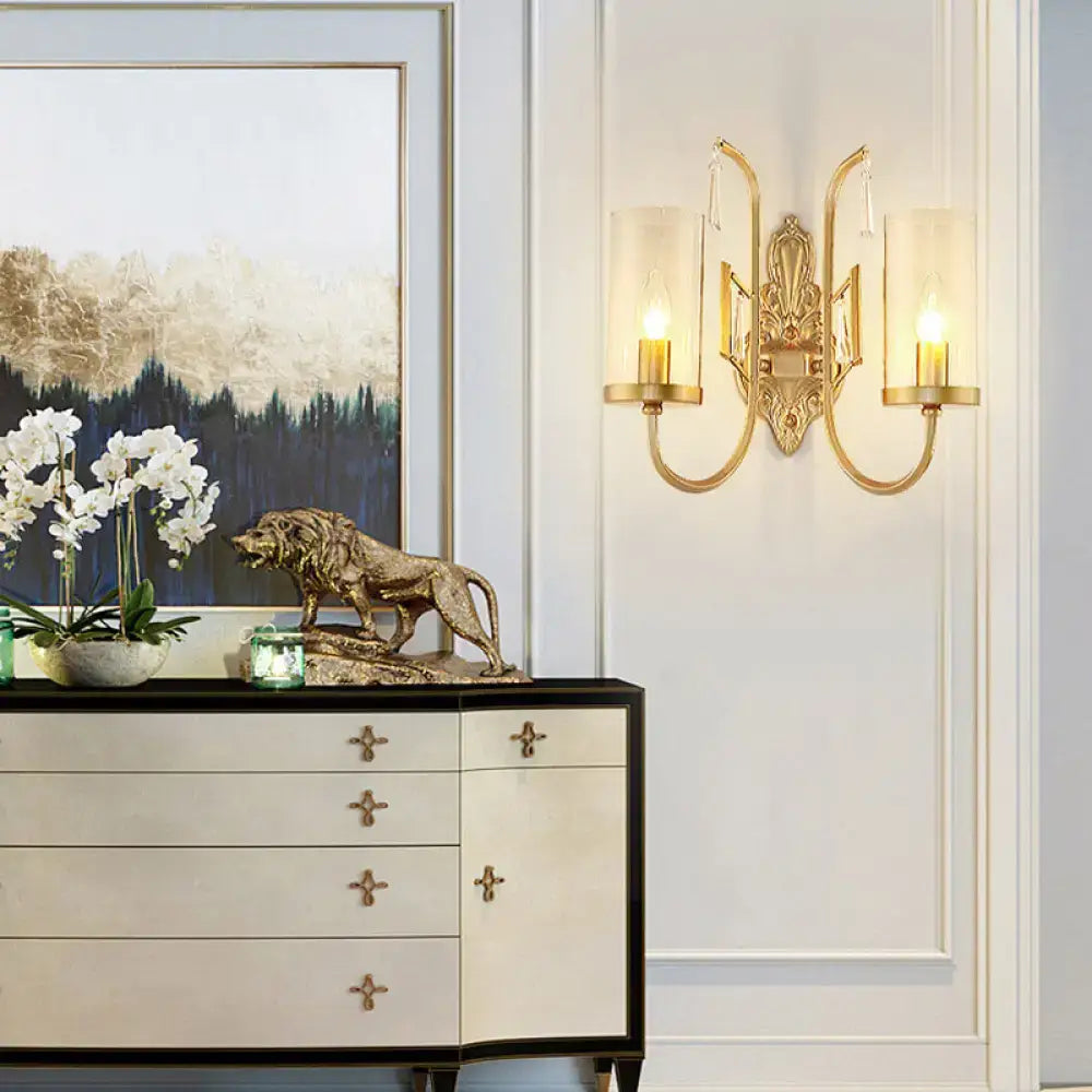 Decorbites gold clear glass wall sconce with dual lights and ornate backplate on Tampa Home & Garden Store