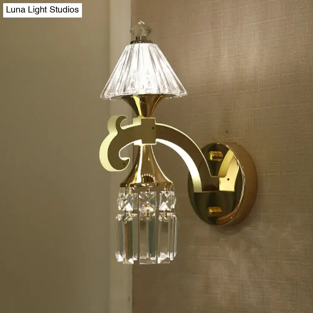 Gold-tone crystal bedroom sconce with clear glass shade and hanging prisms on Tampa Home & Garden Store