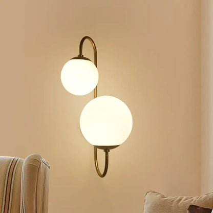 Decorbites gold opal glass ball shades dual-arm sconce brass finish on Tampa Home & Garden Store