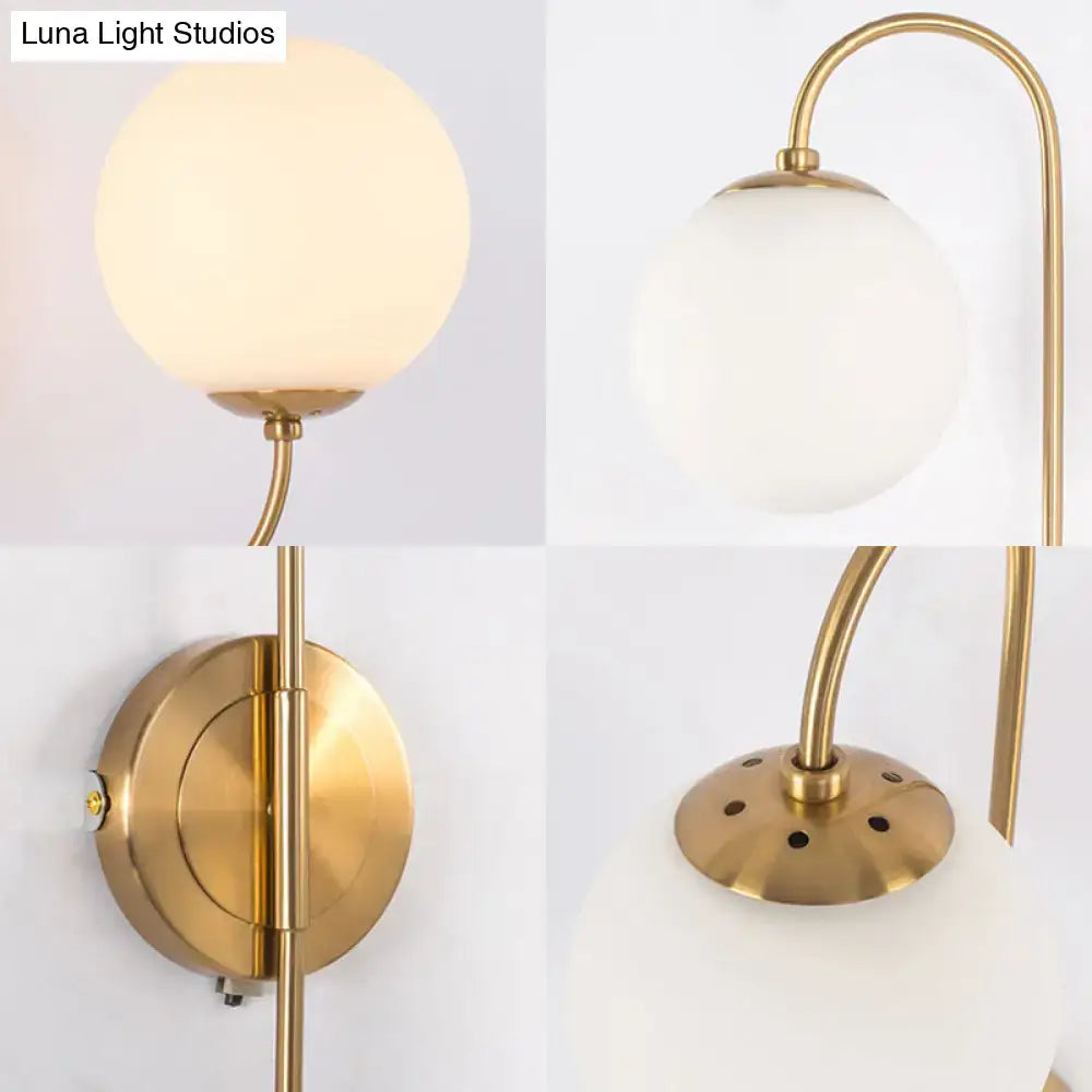 Gold Opal Globe 2-Light Sconce by Decorbites with brass finish and curved arm on wall mount on Tampa Home & Garden Store