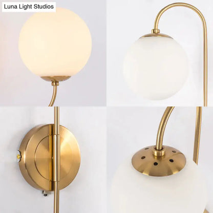Gold Opal Globe 2-Light Sconce by Decorbites with brass finish and curved arm on wall mount on Tampa Home & Garden Store