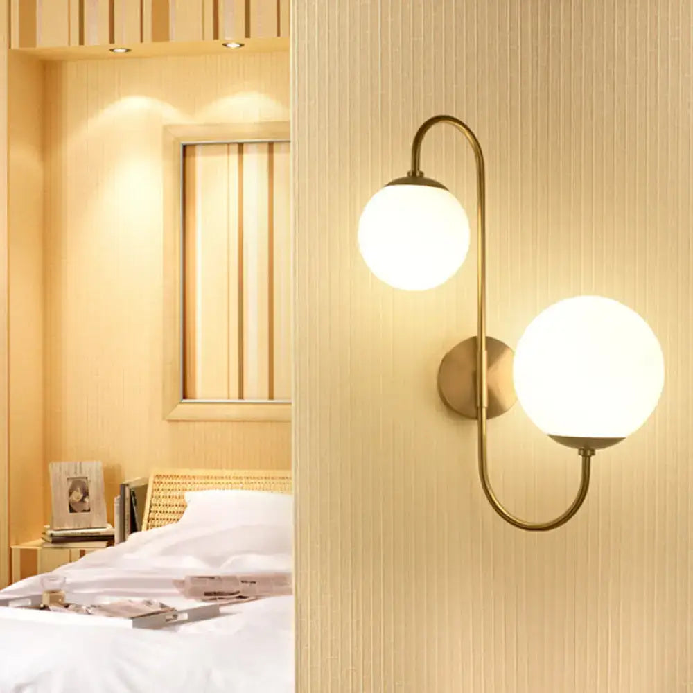Gold Opal Globe 2-Light Wall Sconce by Decorbites with brass curved arm and frosted globes on Tampa Home & Garden Store
