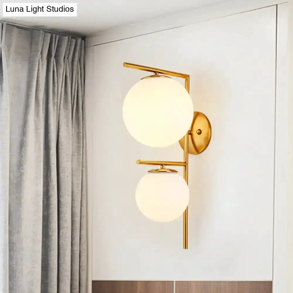 Contemporary gold and white spherical glass bedroom wall sconce with dual globes Decorbites on Tampa Home & Garden Store