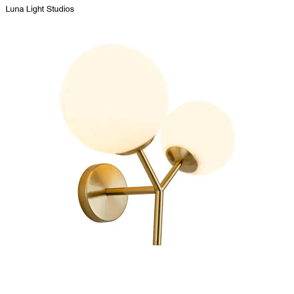 Contemporary gold & white spherical glass two-globe bedroom sconce with brass mount Decorbites on Tampa Home & Garden Store