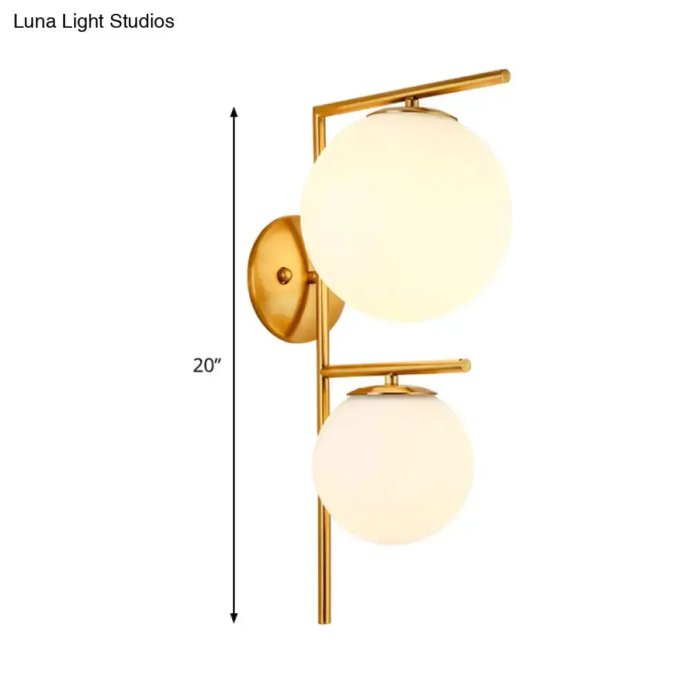 Decorbites contemporary gold and white spherical glass bedroom sconce with dual globes on Tampa Home & Garden Store