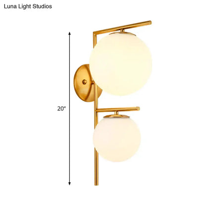 Decorbites contemporary gold and white spherical glass bedroom sconce with dual globes on Tampa Home & Garden Store