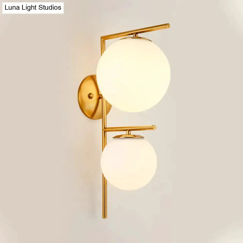 Contemporary gold brass two-sphere frosted glass wall sconce for bedroom by Decorbites on Tampa Home & Garden Store