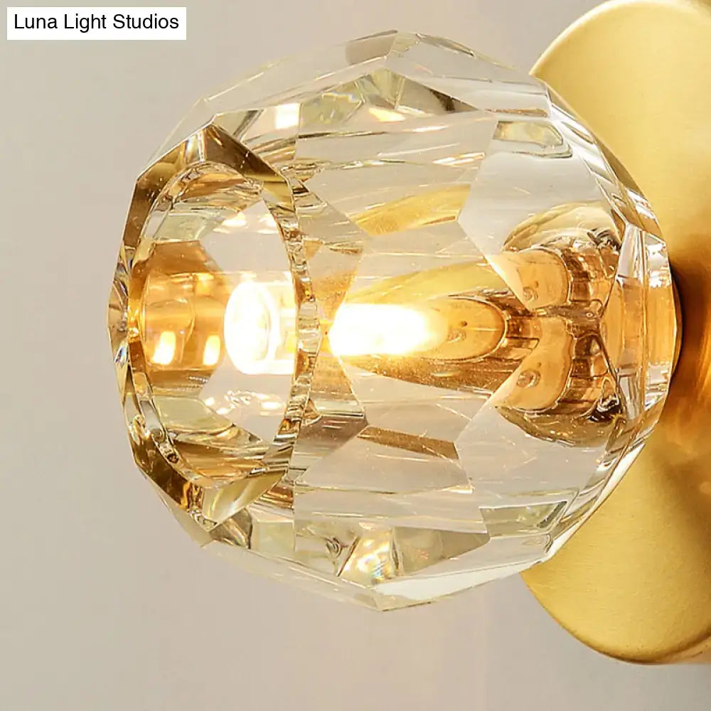 Gold Faceted Wall Lamp with crystal globe shade and warm amber glow on Tampa Home & Garden Store