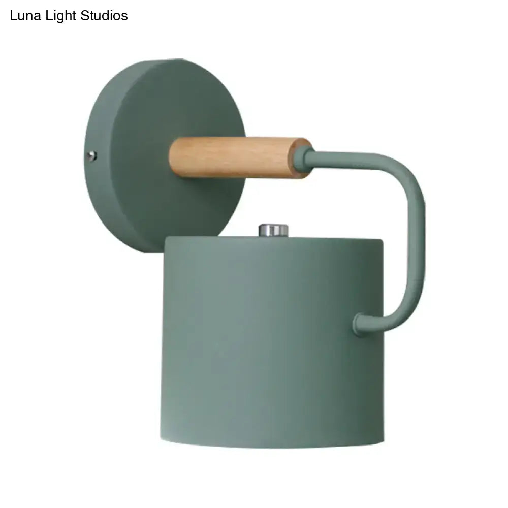 Gray metal wall sconce with wood accent and curved arm by Decorbites on Tampa Home & Garden Store