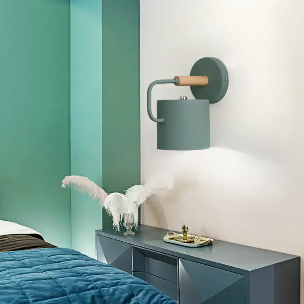 Gray metal wall sconce by Decorbites, with wood arm and teal wall mount, single fixture on Tampa Home & Garden Store
