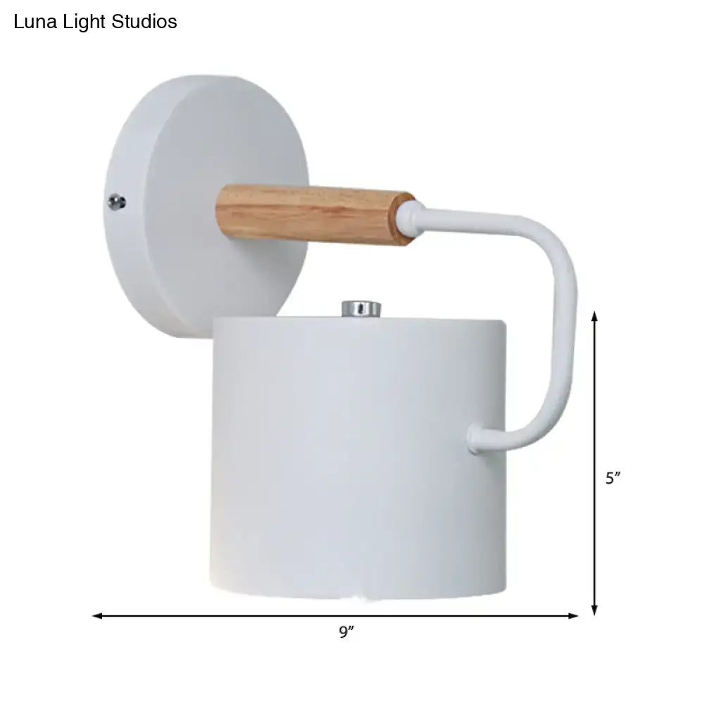 Gray metal wall sconce with cylindrical shade and wood-accent arm Decorbites on Tampa Home & Garden Store