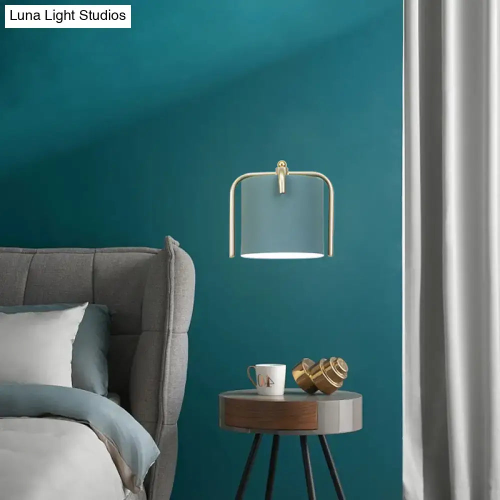 Green gray metal sconce with brass arch frame and blue-gray shade, wall light decor on Tampa Home & Garden Store