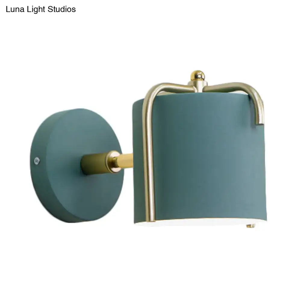 Green gray metal wall sconce with brass trim by Decorbites on Tampa Home & Garden Store