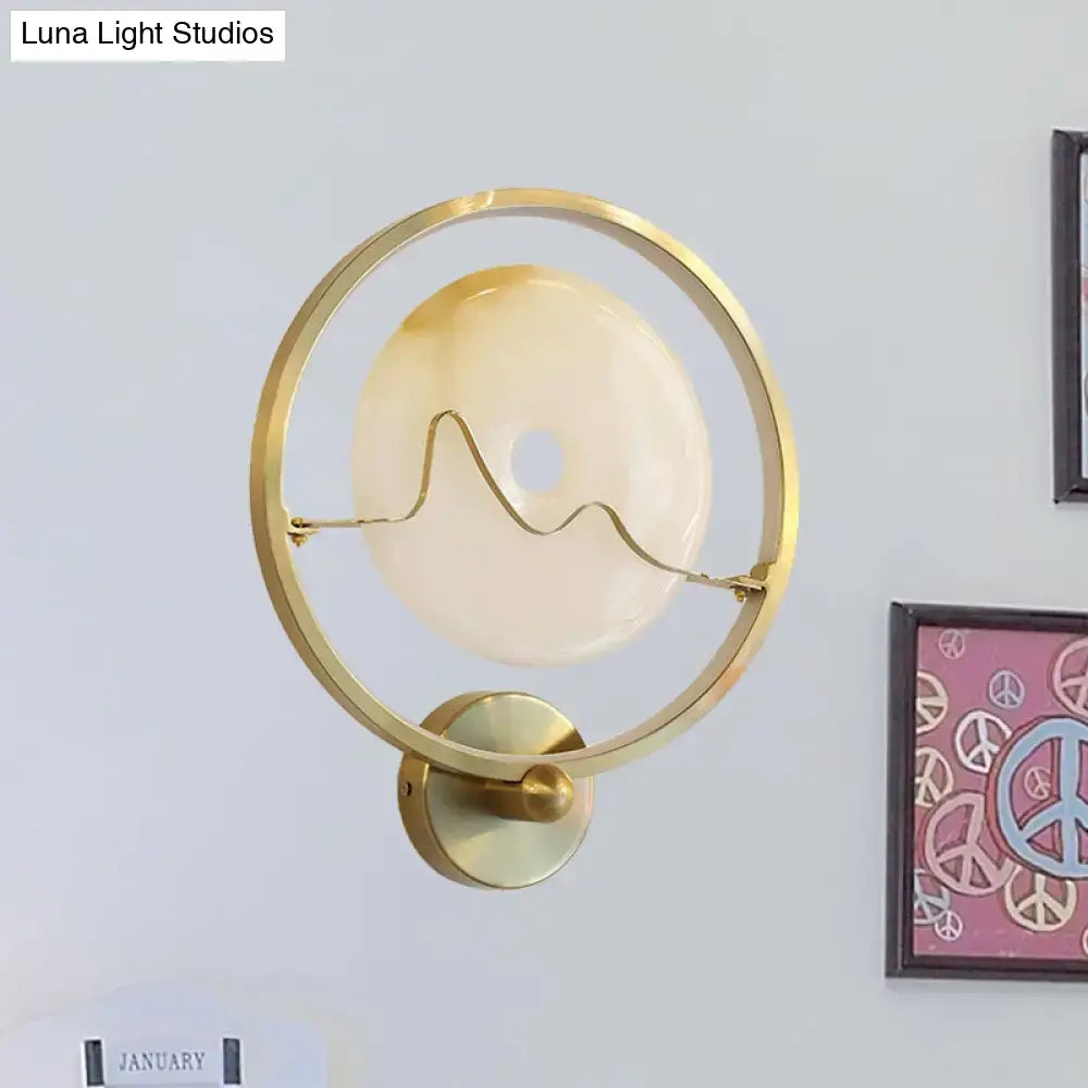 Decorbites Jade Gold Wall Sconce with circular gold ring and frosted glass disc on Tampa Home & Garden Store