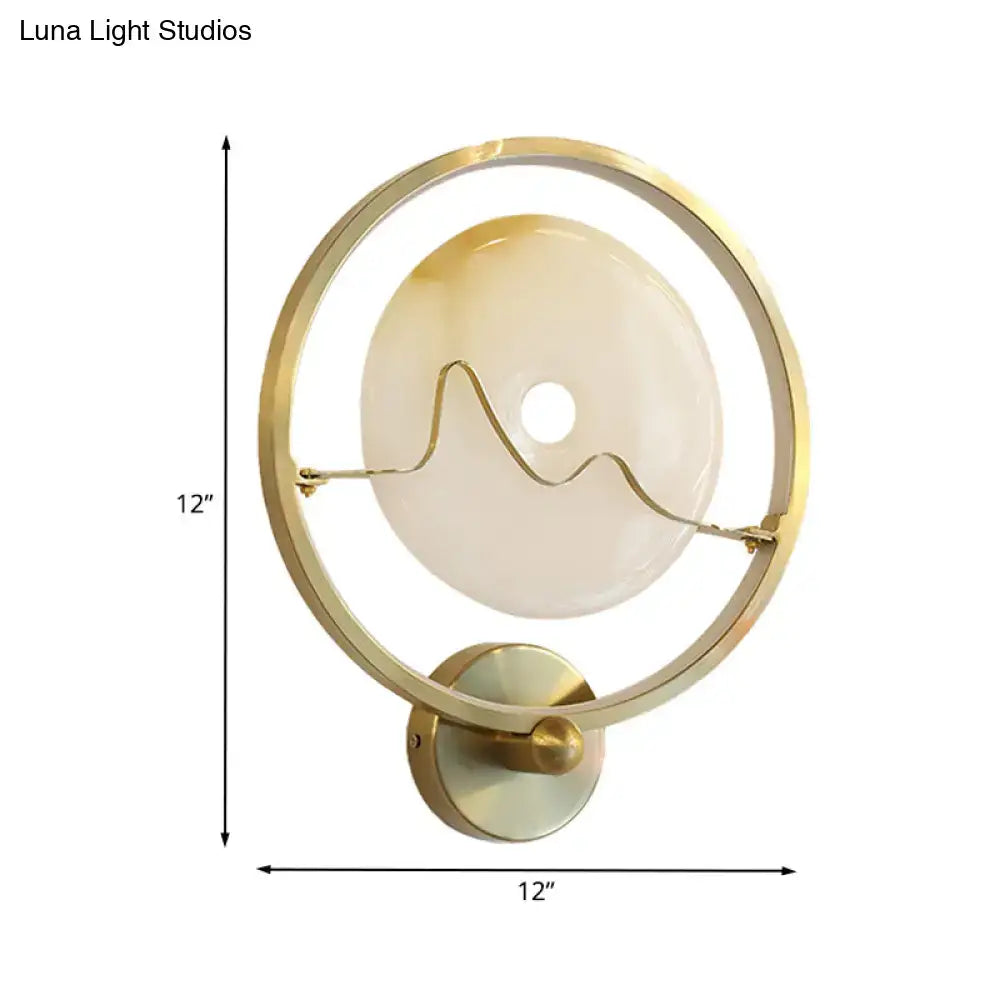 Jade Gold Wall Sconce with circular gold ring and jade glass disk wave accent on Tampa Home & Garden Store