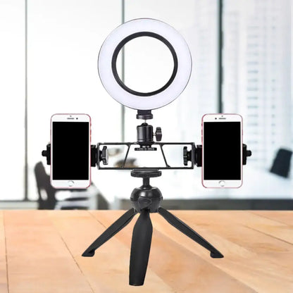 Black tripod LED lamp with circular ring light and dual phone clamps on a desktop on Tampa Home & Garden Store