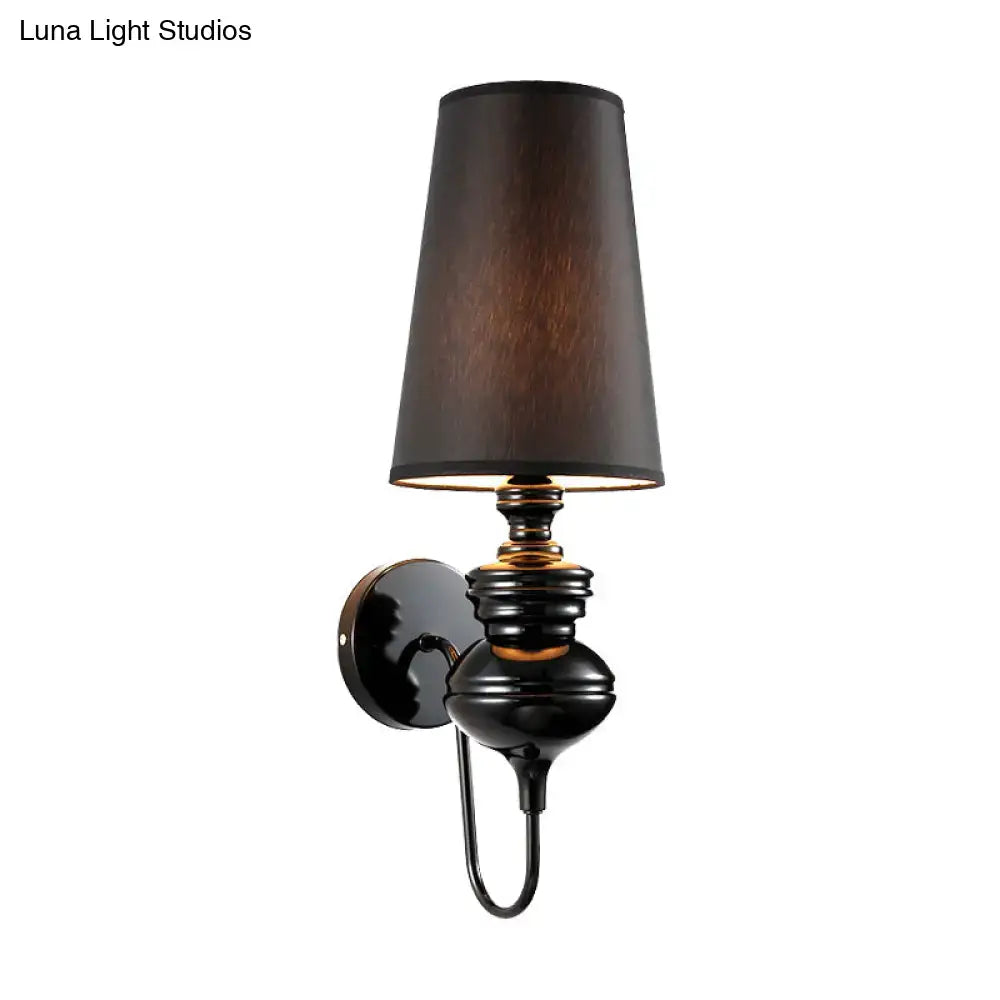 Matte black fabric sconce with black shade and gold-tone accents for wall mounting on Tampa Home & Garden Store