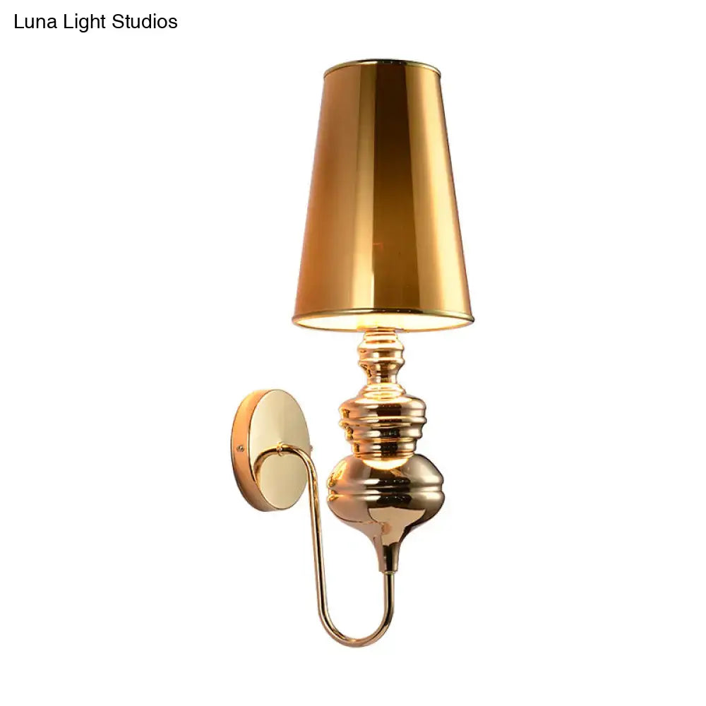Gold brass wall sconce with tall tapered shade, ornate stacked base, wall mount on Tampa Home & Garden Store