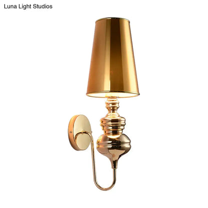 Gold brass wall sconce with tall tapered shade, ornate stacked base, wall mount on Tampa Home & Garden Store