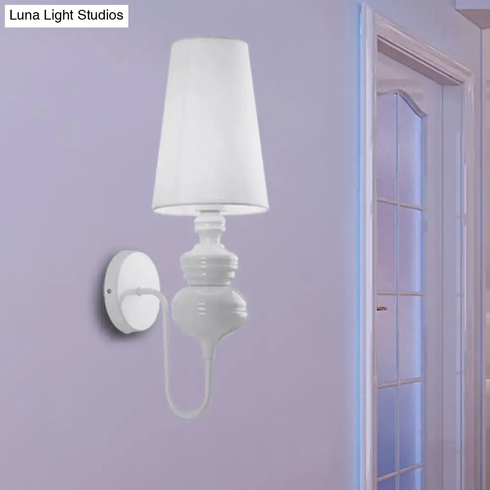 Wall sconce Decorbites with white fabric shade and ceramic-style base on Tampa Home & Garden Store