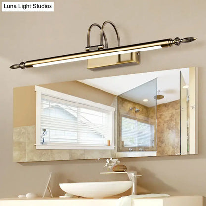Contemporary nickel finish LED wall sconce with a long bar above a vanity mirror on Tampa Home & Garden Store