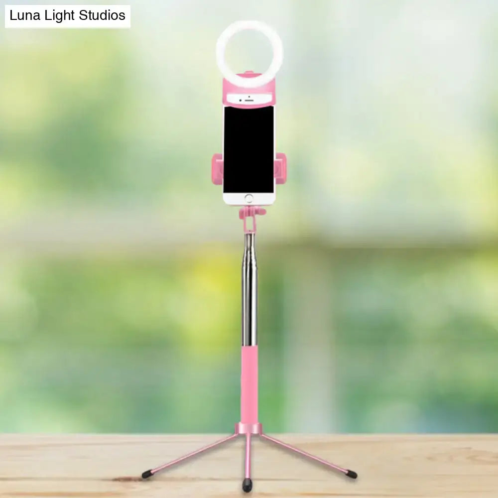 Pink LED phone holder light with ring light atop a pink tripod selfie stick on Tampa Home & Garden Store