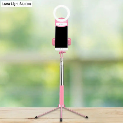 Pink LED phone holder light with ring light atop a pink tripod selfie stick on Tampa Home & Garden Store