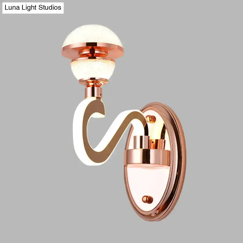 Contemporary rose gold urn wall lamp with curved arm and double globe bulbs on Tampa Home & Garden Store