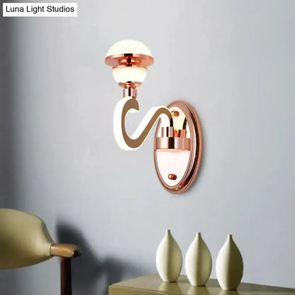 Contemporary rose gold urn wall lamp with curved arm and glass globe Decorbites bedroom lighting on Tampa Home & Garden Store