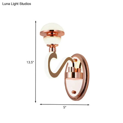 Contemporary rose gold urn wall lamp with curved arm and glass shade by Decorbites on Tampa Home & Garden Store