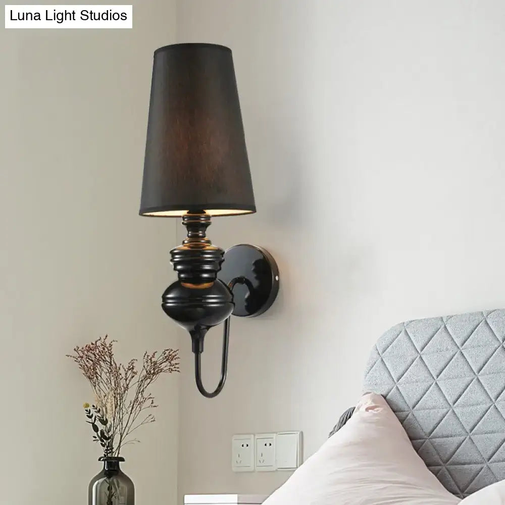 Contemporary black ceramic wall sconce with tapered shade and ribbed body, Decorbites on Tampa Home & Garden Store