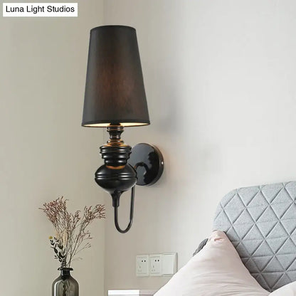 Contemporary black ceramic wall sconce with tapered shade and ribbed body, Decorbites on Tampa Home & Garden Store