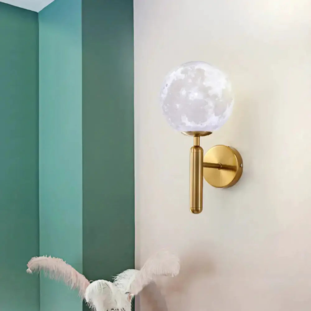 Contemporary white glass wall sconce with gold moon-style globe and brass mount Decorbites on Tampa Home & Garden Store