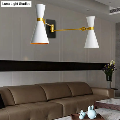 Gold adjustable arm wall sconce by Decorbites with two white cone shades on Tampa Home & Garden Store