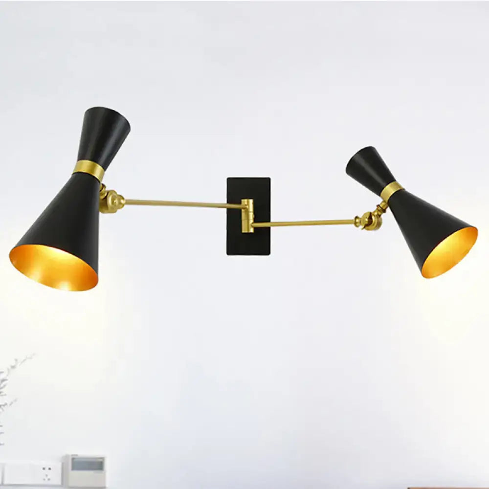 Decorbites two-light gold adjustable arm wall sconce with black shades on a backplate on Tampa Home & Garden Store