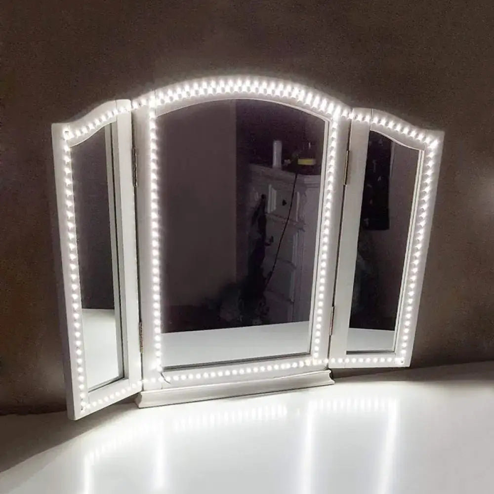 White LED Vanity Mirror by Decorbites with three hinged panels and bright LED border on Tampa Home & Garden Store