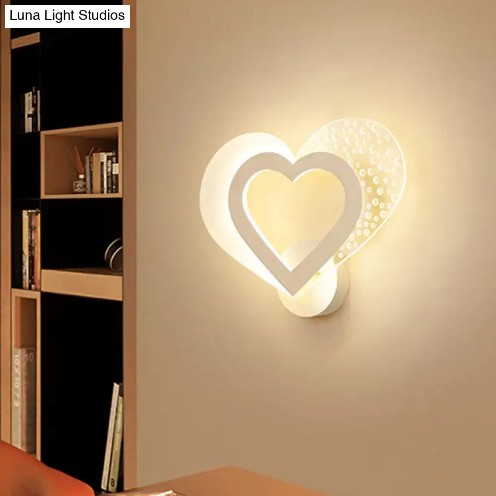 White heart wall sconce by Decorbites with overlapping hearts and warm glow on Tampa Home & Garden Store