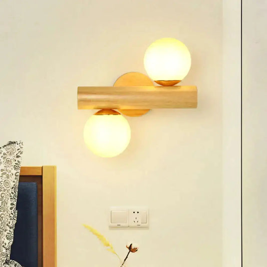 Contemporary white milk glass wall lamp with wooden base and dual spheres Decorbites on Tampa Home & Garden Store