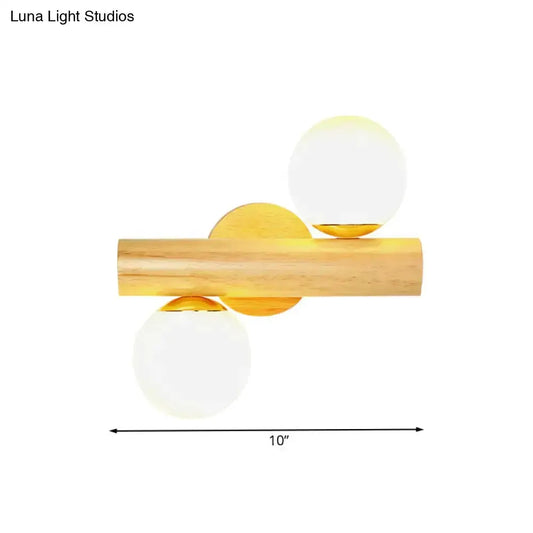 Contemporary white milk glass wall lamp with a wooden base and two globes by Decorbites on Tampa Home & Garden Store
