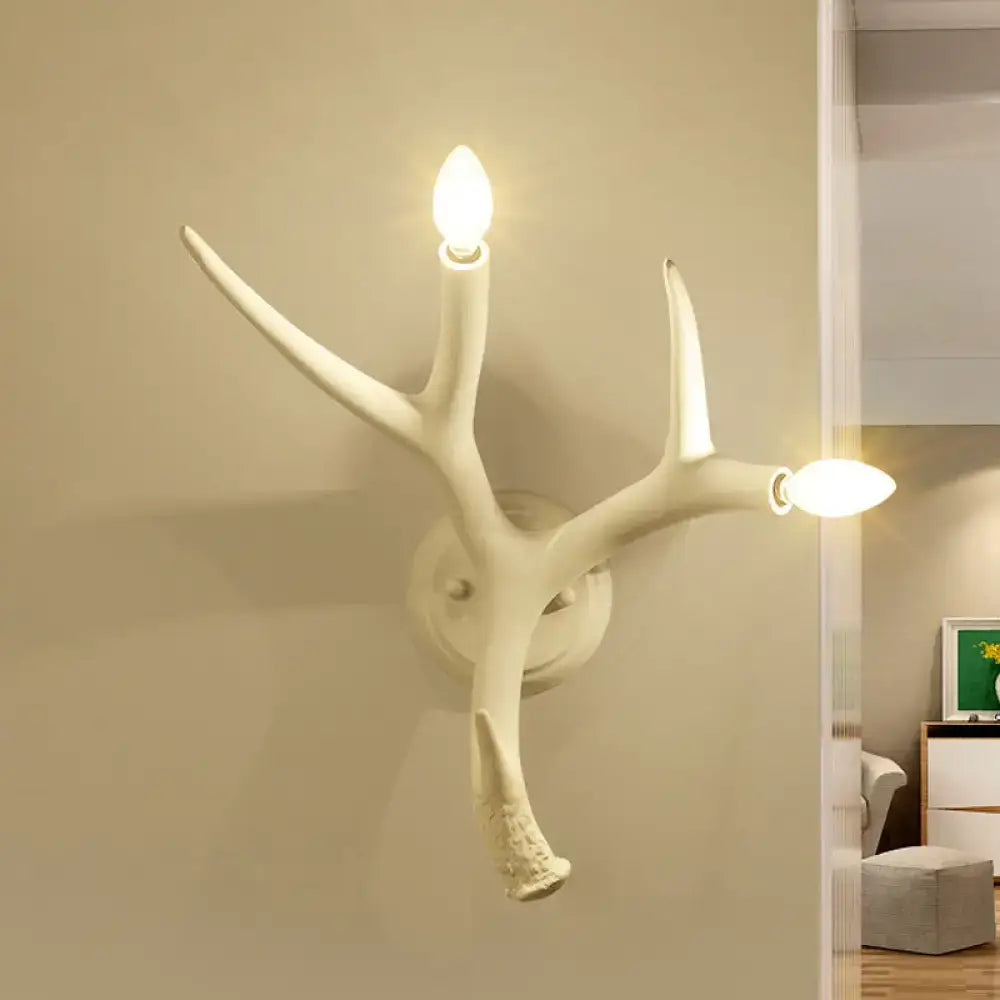White resin antler sconce by Decorbites, wall-mounted two-light branch lamp on Tampa Home & Garden Store