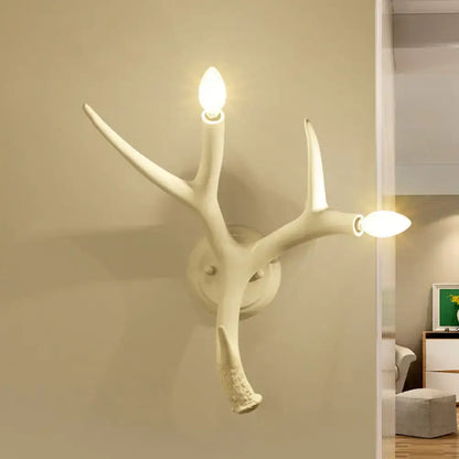 White resin antler sconce by Decorbites, wall-mounted two-light branch lamp on Tampa Home & Garden Store