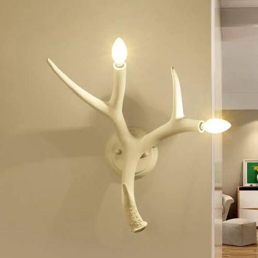 White resin antler sconce by Decorbites, wall-mounted two-light branch lamp on Tampa Home & Garden Store