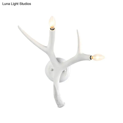 White resin antler wall sconce with three candle bulbs by Decorbites on Tampa Home & Garden Store
