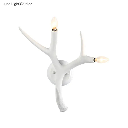 White resin antler wall sconce with three candle bulbs by Decorbites on Tampa Home & Garden Store
