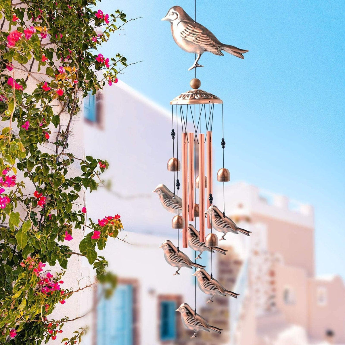 Copper wind chimes with bird accents by Stevvex for outdoor garden memorial decor on Tampa Home & Garden Store