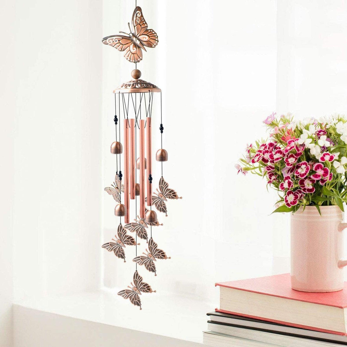 Stevvex copper wind chimes with butterfly accents for outdoor garden decor on Tampa Home & Garden Store