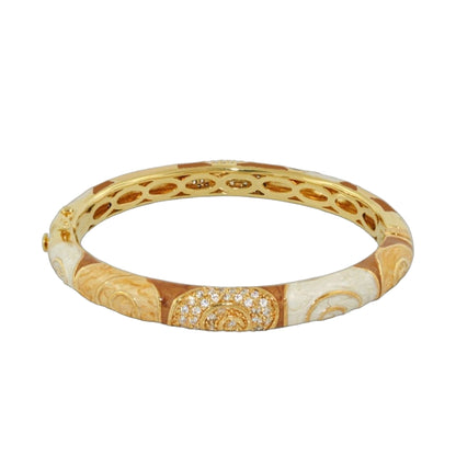 Signature Swirl Bangle gold-tone hinged bracelet with safety lock and pavé accents on Tampa Home & Garden Store