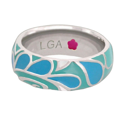 Ceramic mug with teal blue leaf pattern and LGA initials on inner rim on Tampa Home & Garden Store