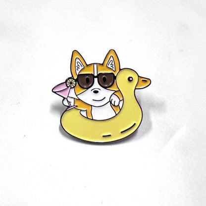 Corgi Floaty enamel pin by Shaketea; yellow dog wearing sunglasses in a yellow floaty on Tampa Home & Garden Store